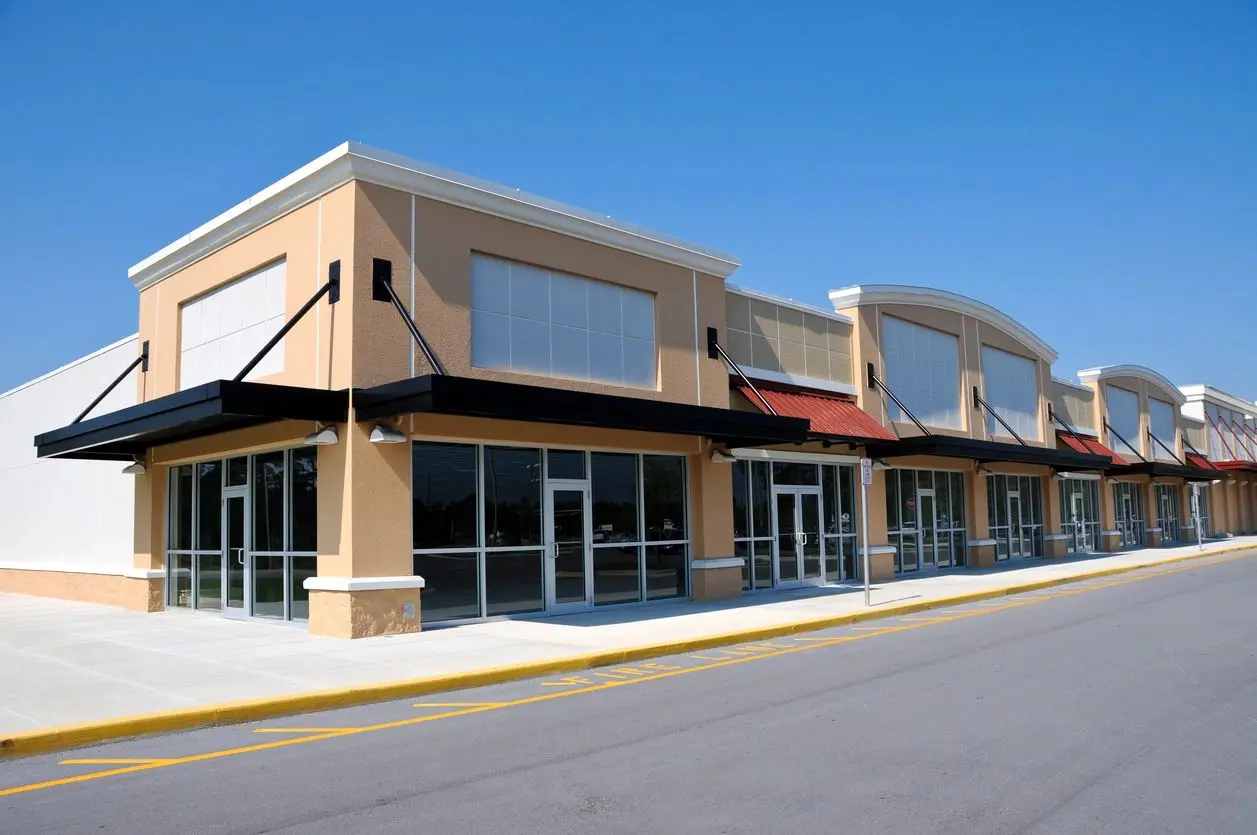 A large commercial building on the side of a street.